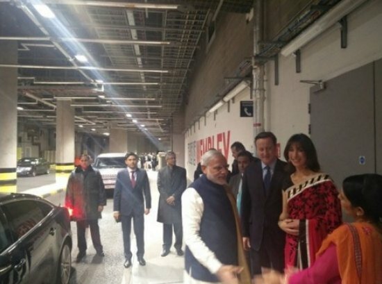 Narendra Modi UK visit 2015: Pics of electric atmosphere at Wembley Stadium for 'UKWelcomesModi' community reception Samantha Cameron in a saree with PM David Cameron welcoming Indian PM Modi to Wembley